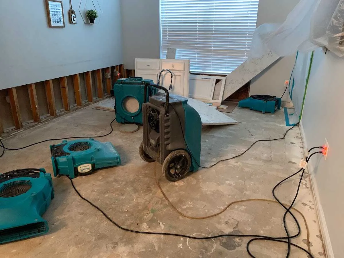 Dehumidifier in flood-cut room for Water Damage Restoration in White Hall